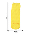 Yellow casual socks laid flat showing crew length size