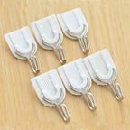 Damage-free self-adhesive hook securely holding multiple towels.
