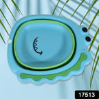 A child's hands being washed in the cute frog design foldable baby wash basin.