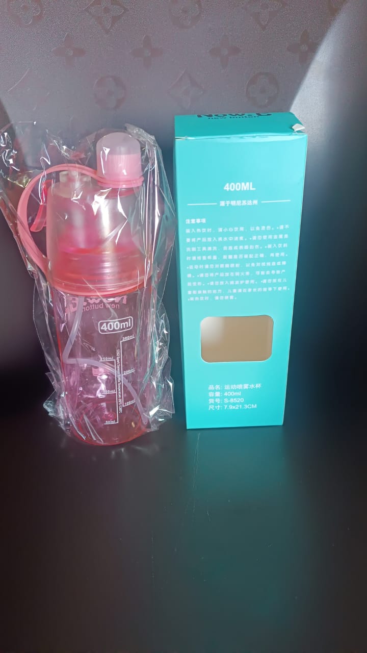 Top view of water bottle cap and built-in mist sprayer for easy use
