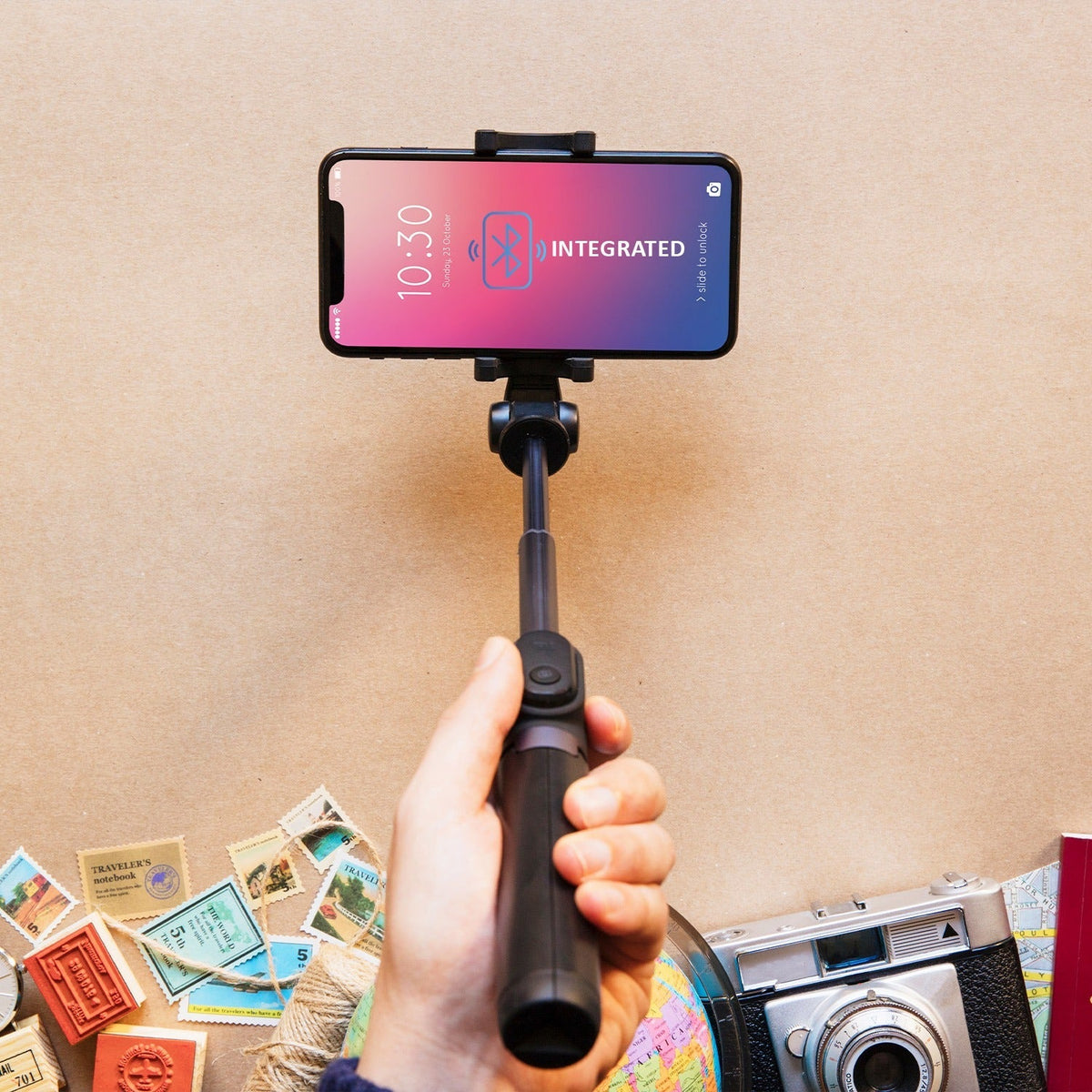 Compact Bluetooth selfie stick with phone tripod stand.