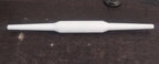Sturdy plastic rolling pin with anti-skid base for stable operation.