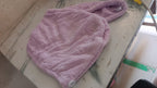 Lifestyle image of a woman comfortably wearing the VelvaBloom turban towel.