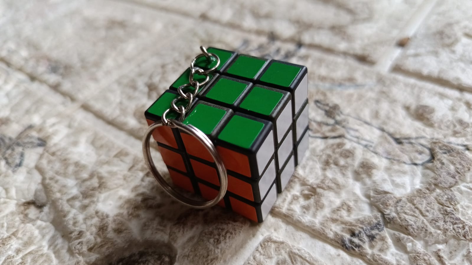 Vibrant Mini Magic Cube Puzzle keychain, a fun brain game for kids.