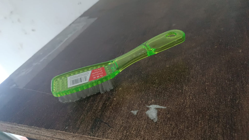Durable scrubbing brush suitable for various household cleaning tasks.