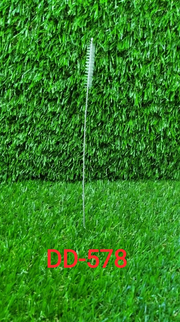 The 23cm long straw brush demonstrating flexible cleaning.