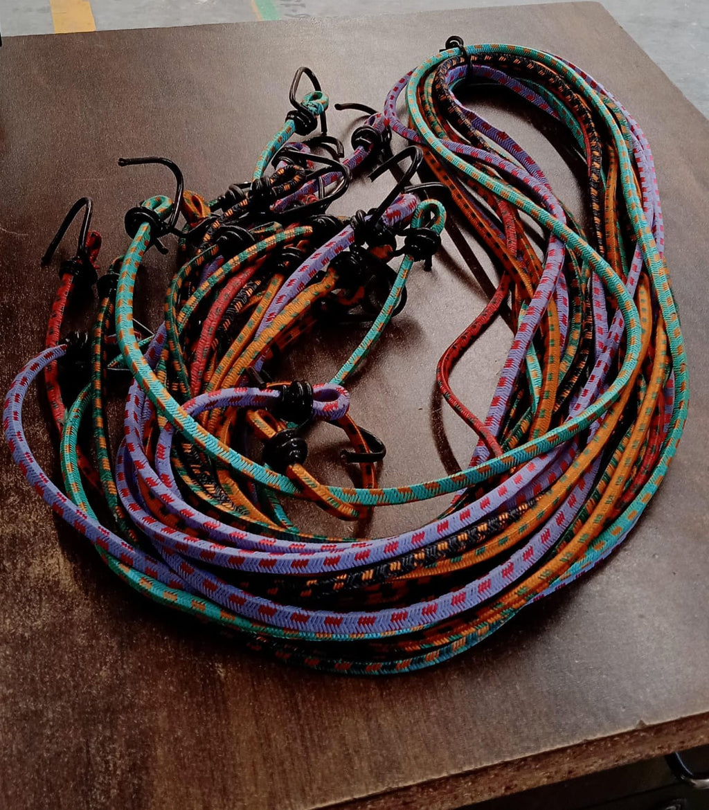 Single multicolor elastic luggage strap displayed clearly on a neutral background.