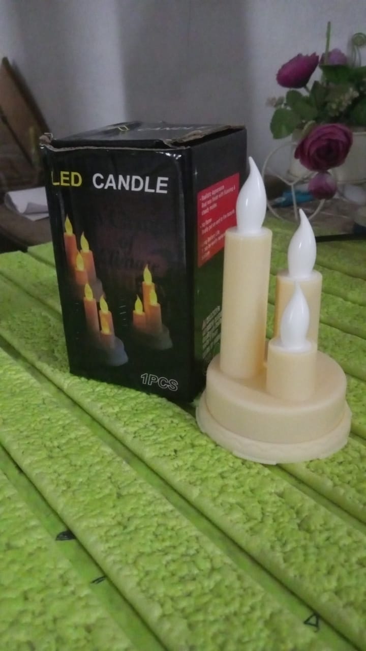 Brightly lit LED taper candles casting a warm glow, ideal for special events and everyday use.