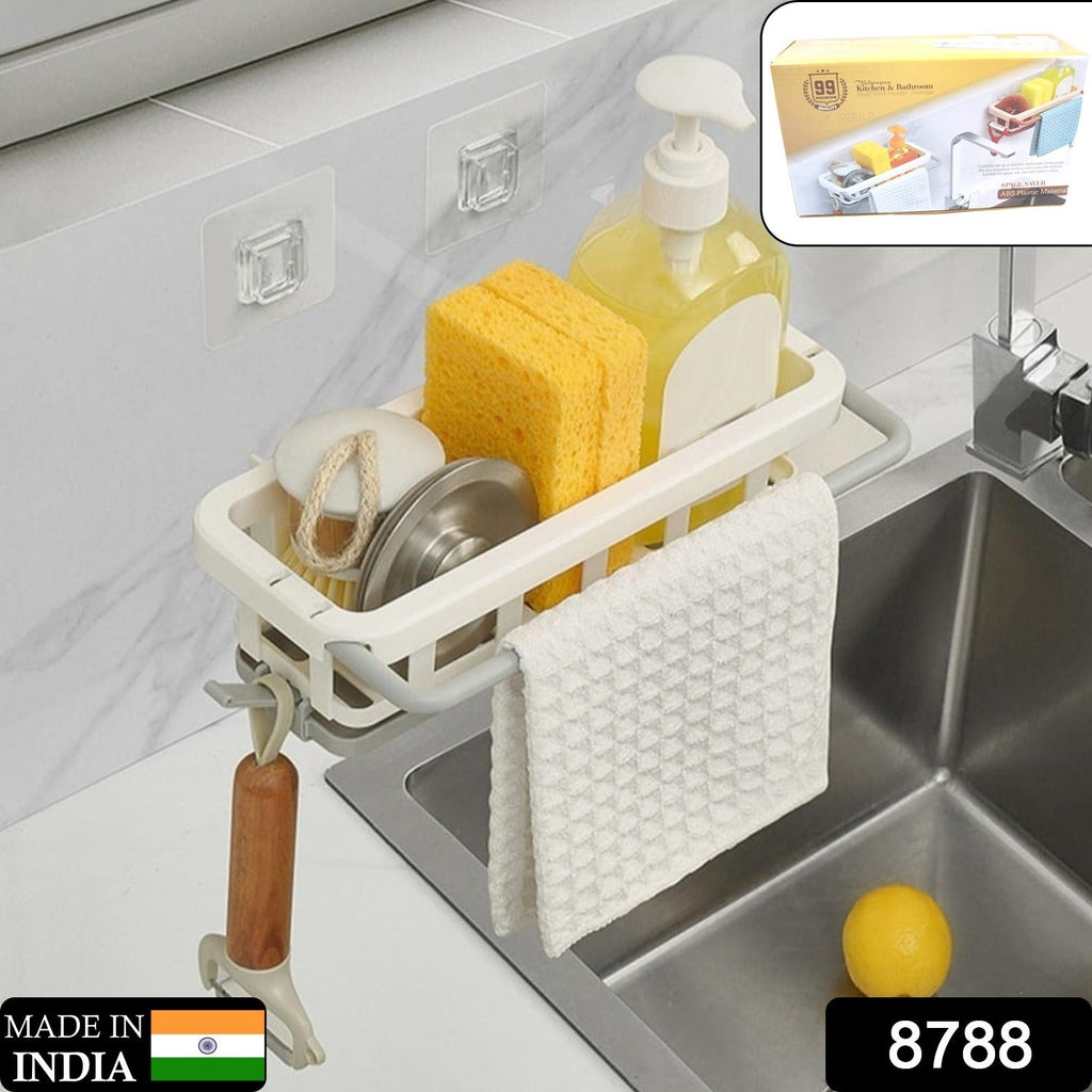 Modern kitchen sink caddy with adhesive hook, neatly storing a sponge, brush, and drying dishcloth.