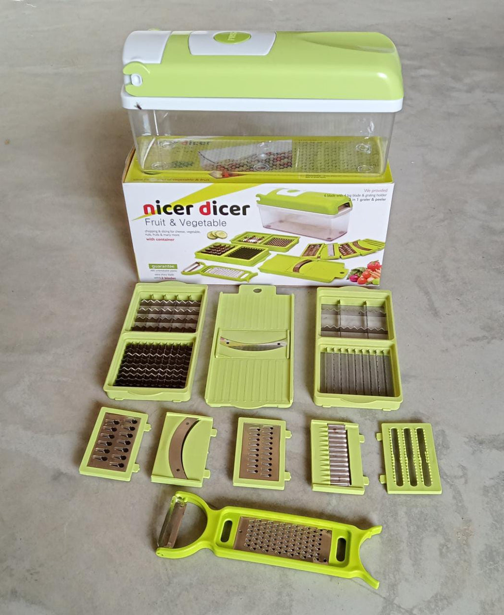 All 13 attachments of the Manual Vegetable Slicer neatly organized for easy selection.