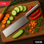 Vegetable cleaver knife chopping fresh vegetables in kitchen