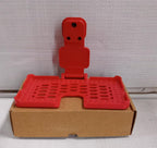 Lifestyle shot of the multi-purpose red wall holder, keeping cables tidy.