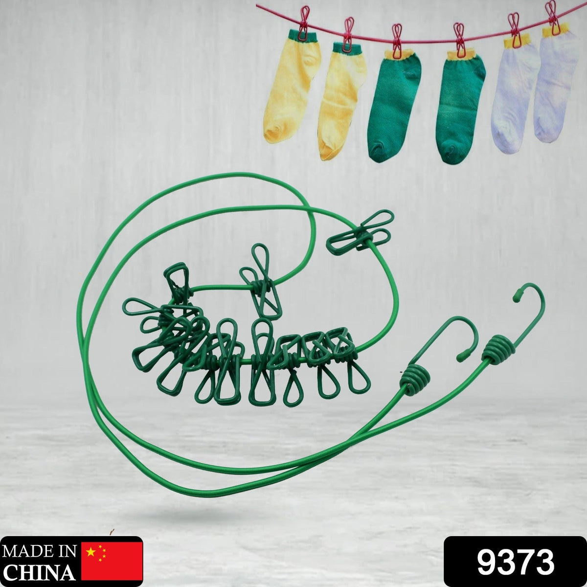 FERVENT portable clothes drying rope stretched out, holding various garments.