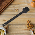 Vibrant red silicone basting brush, ideal for grilling and baking.