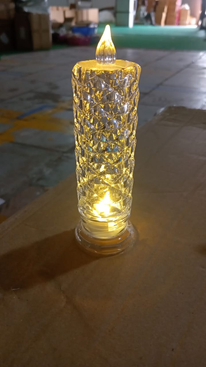 Lifestyle shot of the Crystal LED Candle illuminating a festive setting.
