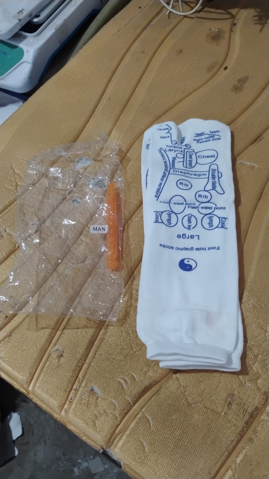 Packaging and accessories for reflexology acupressure socks including massage stick