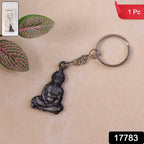 Close-up of Hanuman Ji sitting pose idol on metal keychain