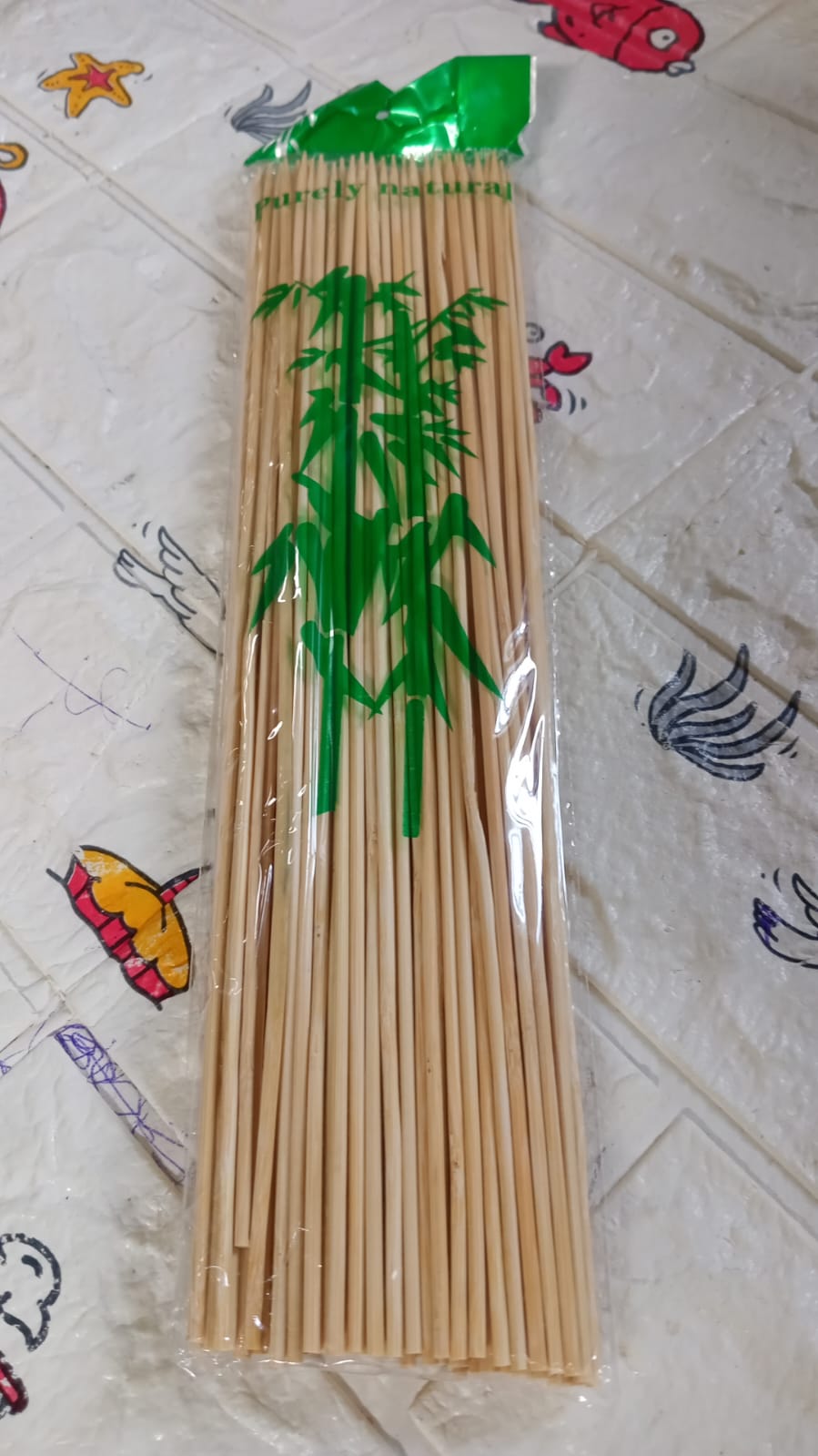 Colorful vegetables and chicken pieces prepared on bamboo shish kabob sticks.