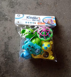 Overhead view of the 5-piece Aditi rattles baby toy collection.