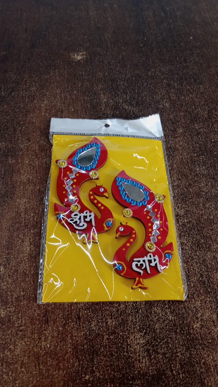 Detailed view of hand-painted wooden Shubh Labh wall hanging with stones and mirrors
