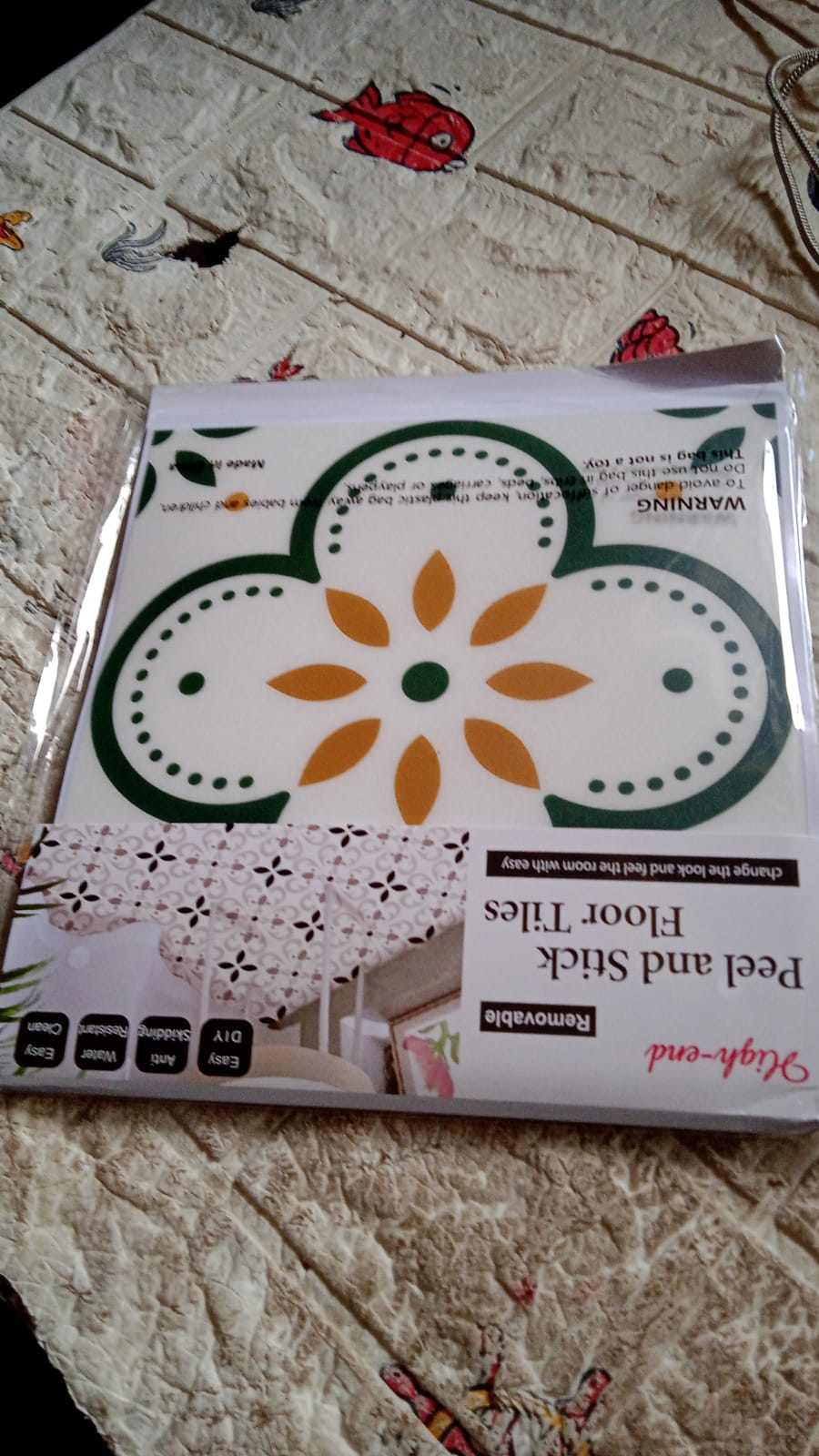 Decorative peel and stick floor tiles adding charm to a kitchen floor.