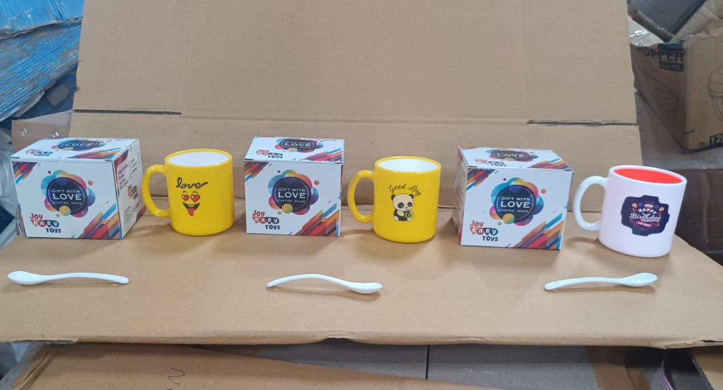 Stylish designer coffee mug with spoon and gift box, ideal for hot beverages.