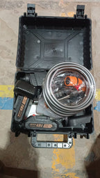 A person using the cordless car washer gun to clean an outdoor surface effectively.