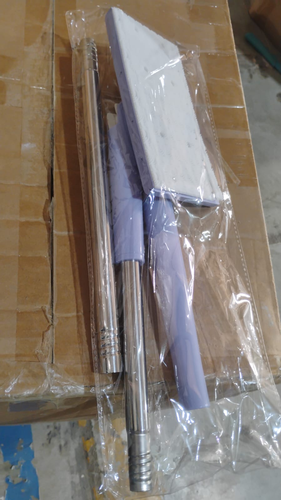 A person holding the Velvet Wipe Mini Mop, ready for daily cleaning tasks.