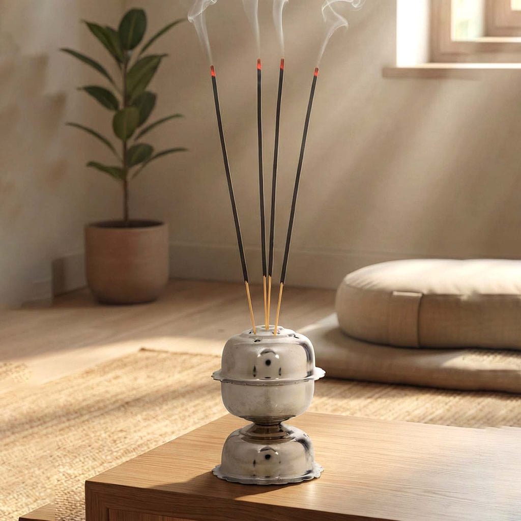 Elegant metal incense holder for home temple and meditation.