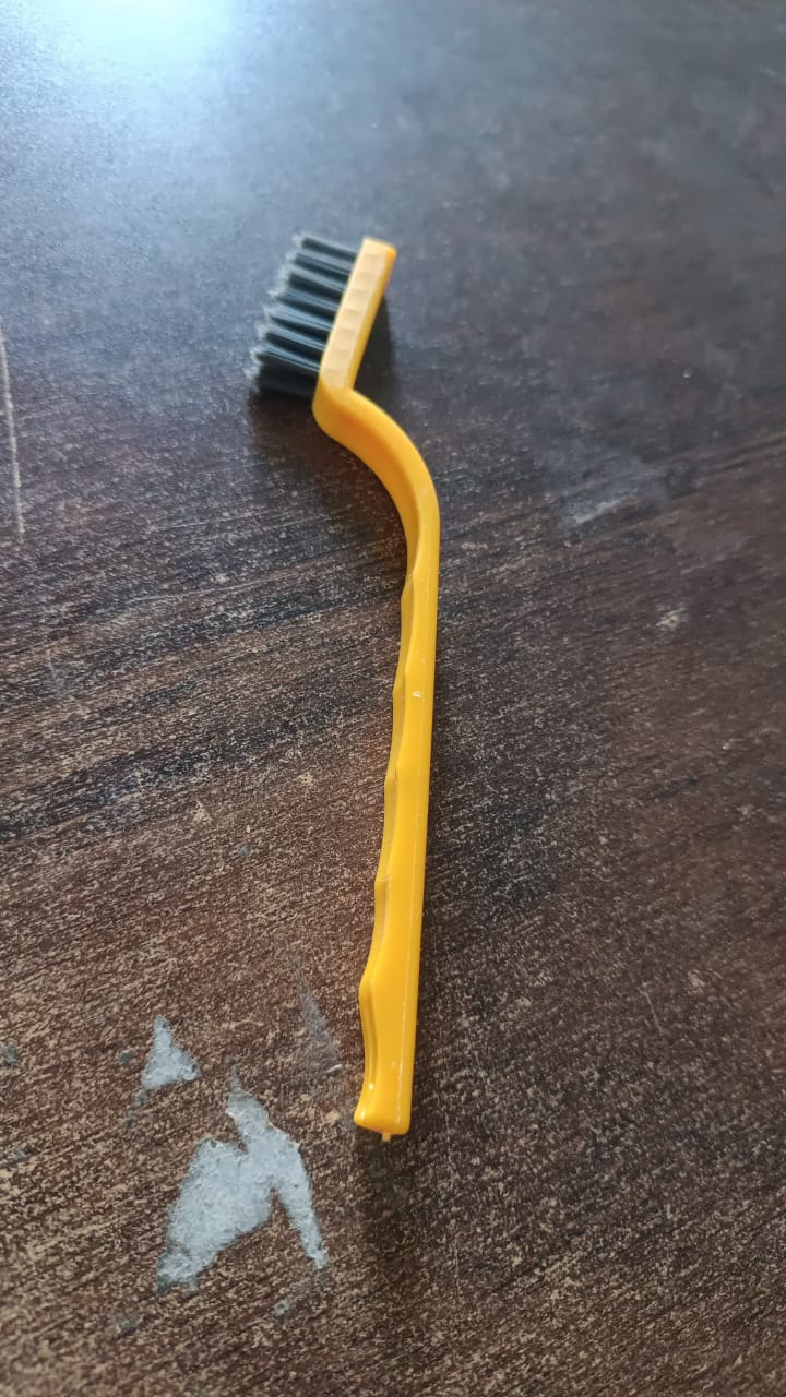 Ergonomic handle of the mini nylon cleaning brush for comfortable grip.