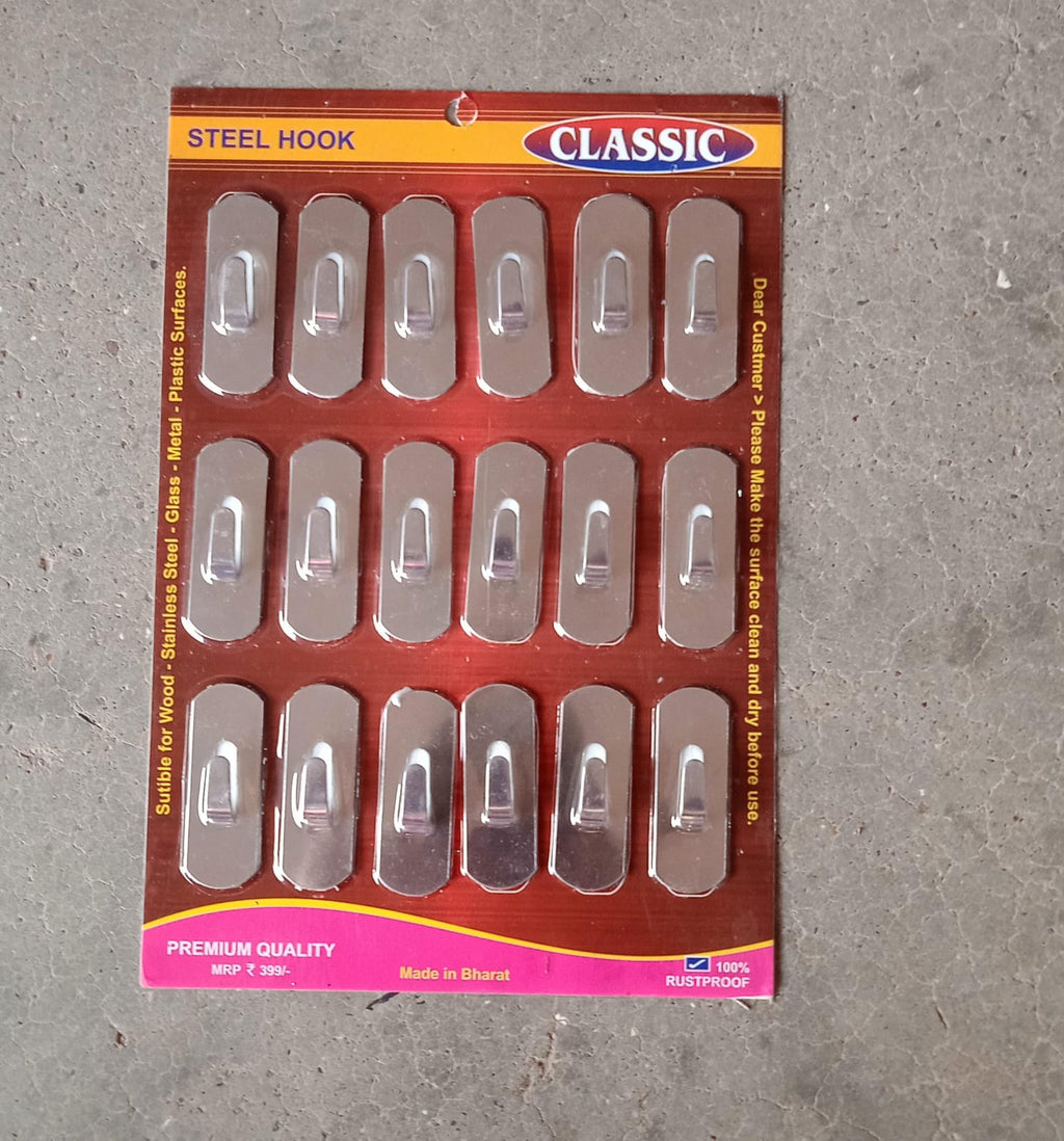 Stainless steel wall hooks securely holding keys and small accessories.