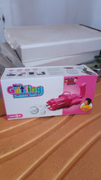 Packaging of the bubble gun toy, illustrating what's included in the box (excluding solution).