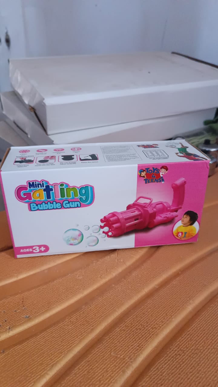 Packaging of the bubble gun toy, illustrating what's included in the box (excluding solution).