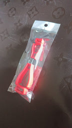 Two parts of the glove clip holder, highlighting its safety breakaway feature.