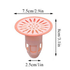 Effective hair trap plug made of silicone, shown in a kitchen sink to prevent food debris.