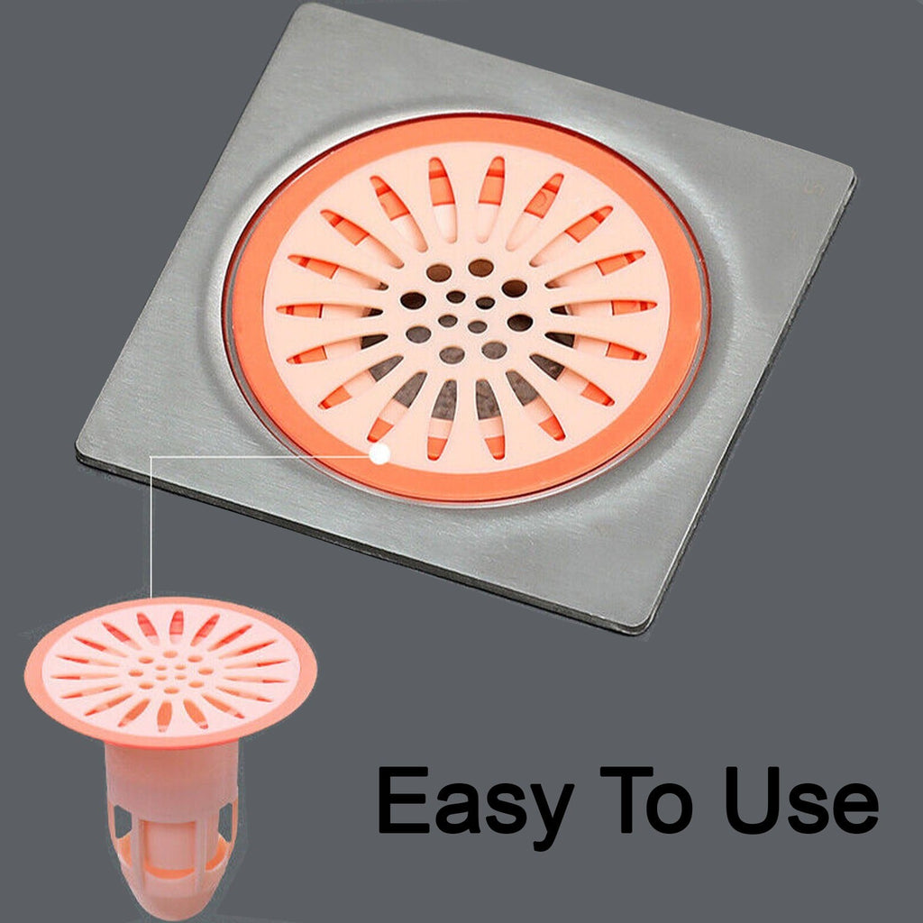 A hand demonstrating the easy installation of the insect-proof silicone floor drain stopper.