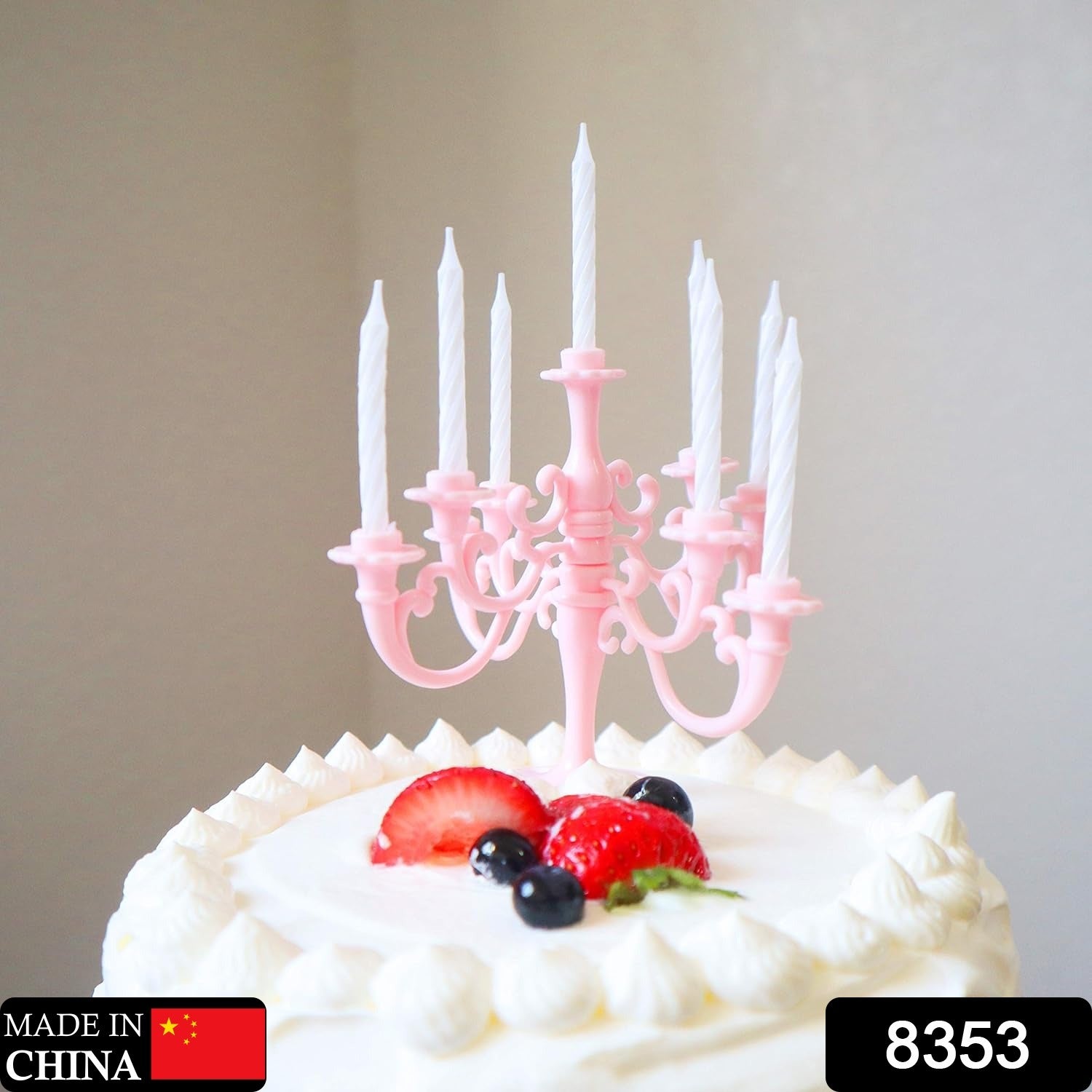 Close-up of the elegant candle holders and metallic birthday candles, showcasing their intricate design.
