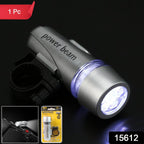 Powerful white LED bicycle headlight illuminating a dark road ahead.