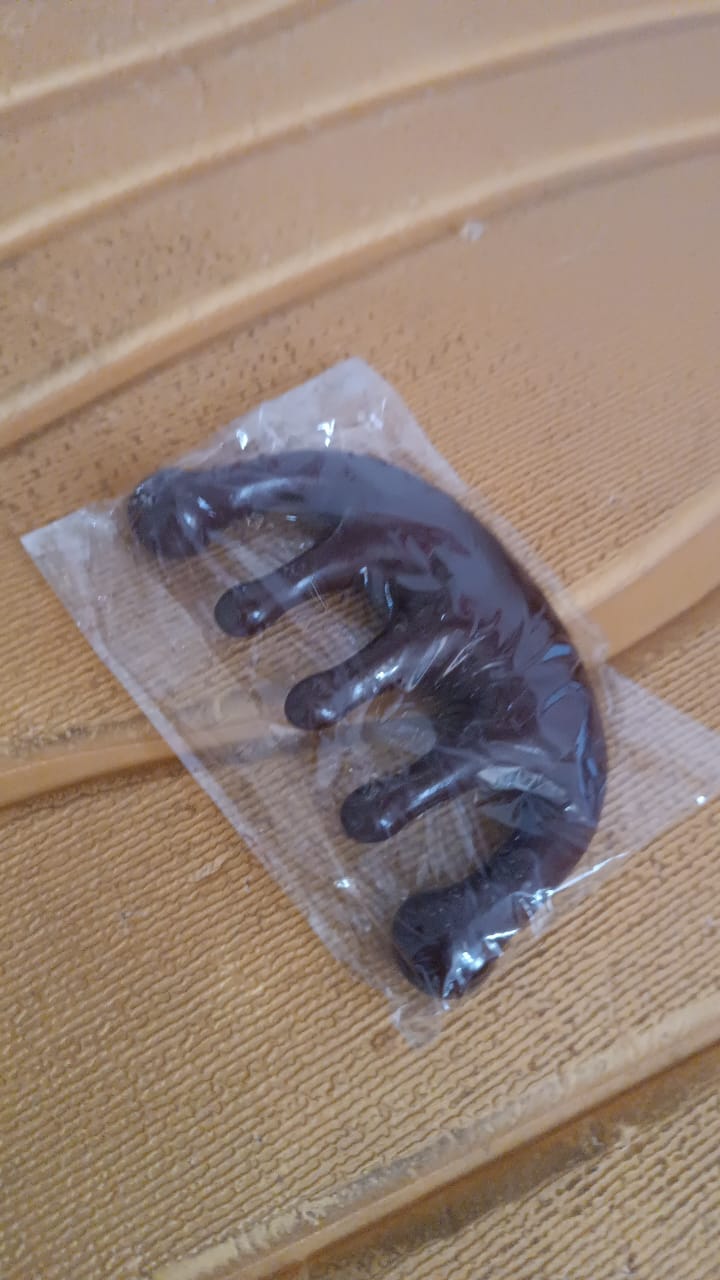 Angled view of scalp relaxer massager comb for stress relief