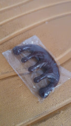 Angled view of scalp relaxer massager comb for stress relief