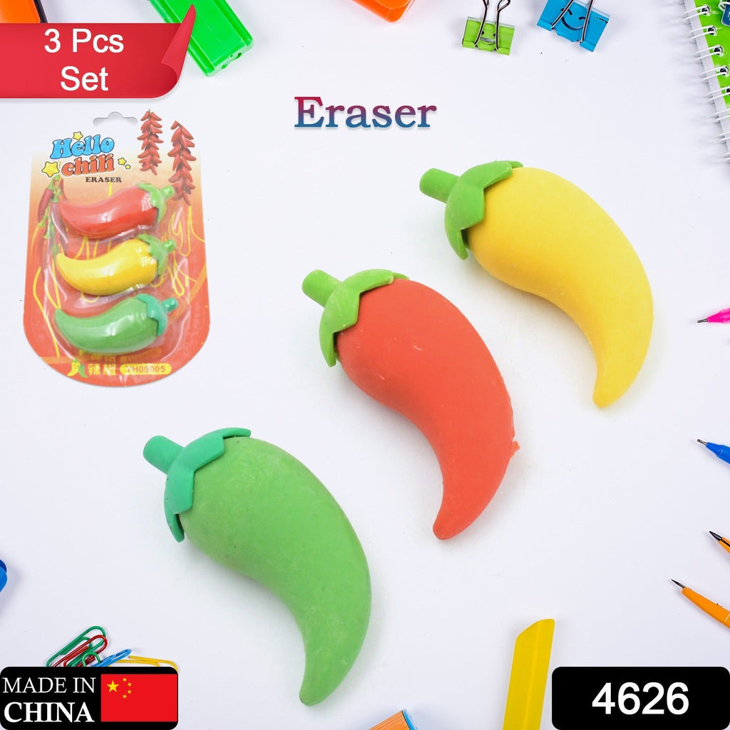 A child's hand holding a red chili shape eraser, showing its compact size.