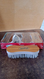 Detailed view of cleaning brush bristles with ergonomic grip for effective stain removal