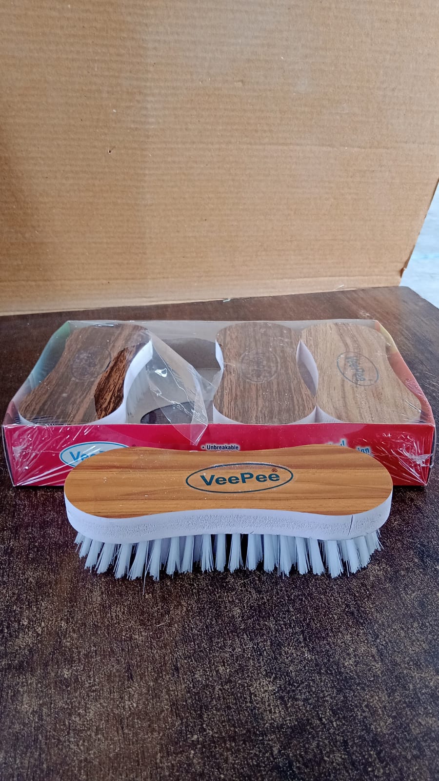 Detailed view of cleaning brush bristles with ergonomic grip for effective stain removal