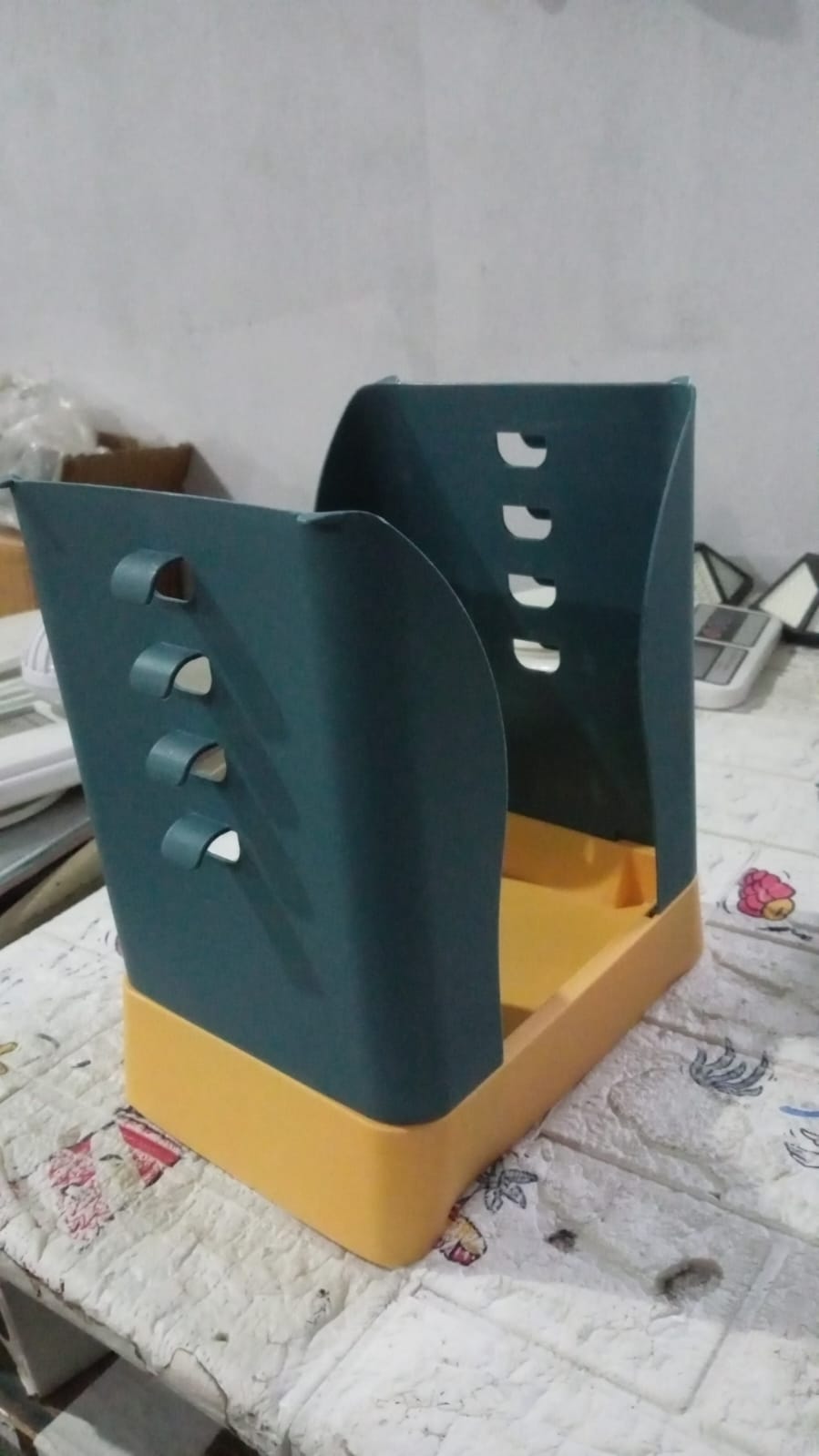 Household expandable garbage bin in blue and orange, designed for convenient waste management.