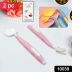 A baby learning to eat independently with a bendable silicone spoon.