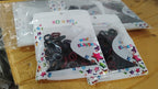 A bundled group of vibrant small hairbands, demonstrating their compact size and elasticity for secure hold.