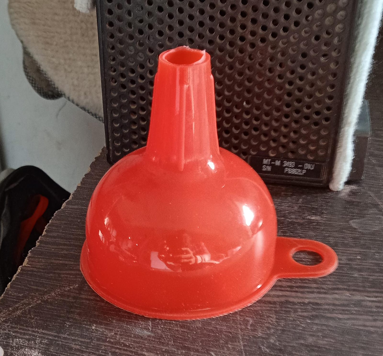 Vibrant red silicone funnel, adding a pop of color to your kitchen tools.