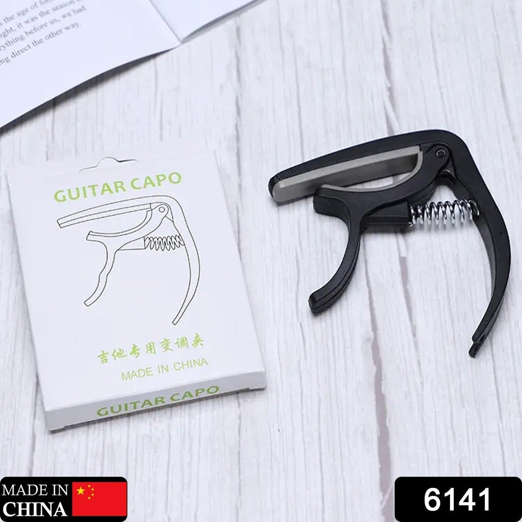Close-up view of the Wagtail guitar capo's memory spring mechanism for consistent tension.
