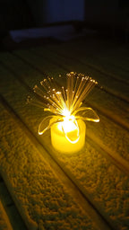 Several fiber optic LED centerpieces scattered for event lighting.