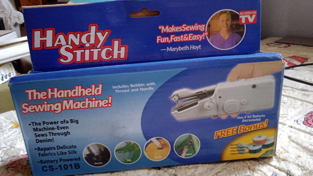 Detailed view of the  mini electric sewing machine, showing its ergonomic grip.